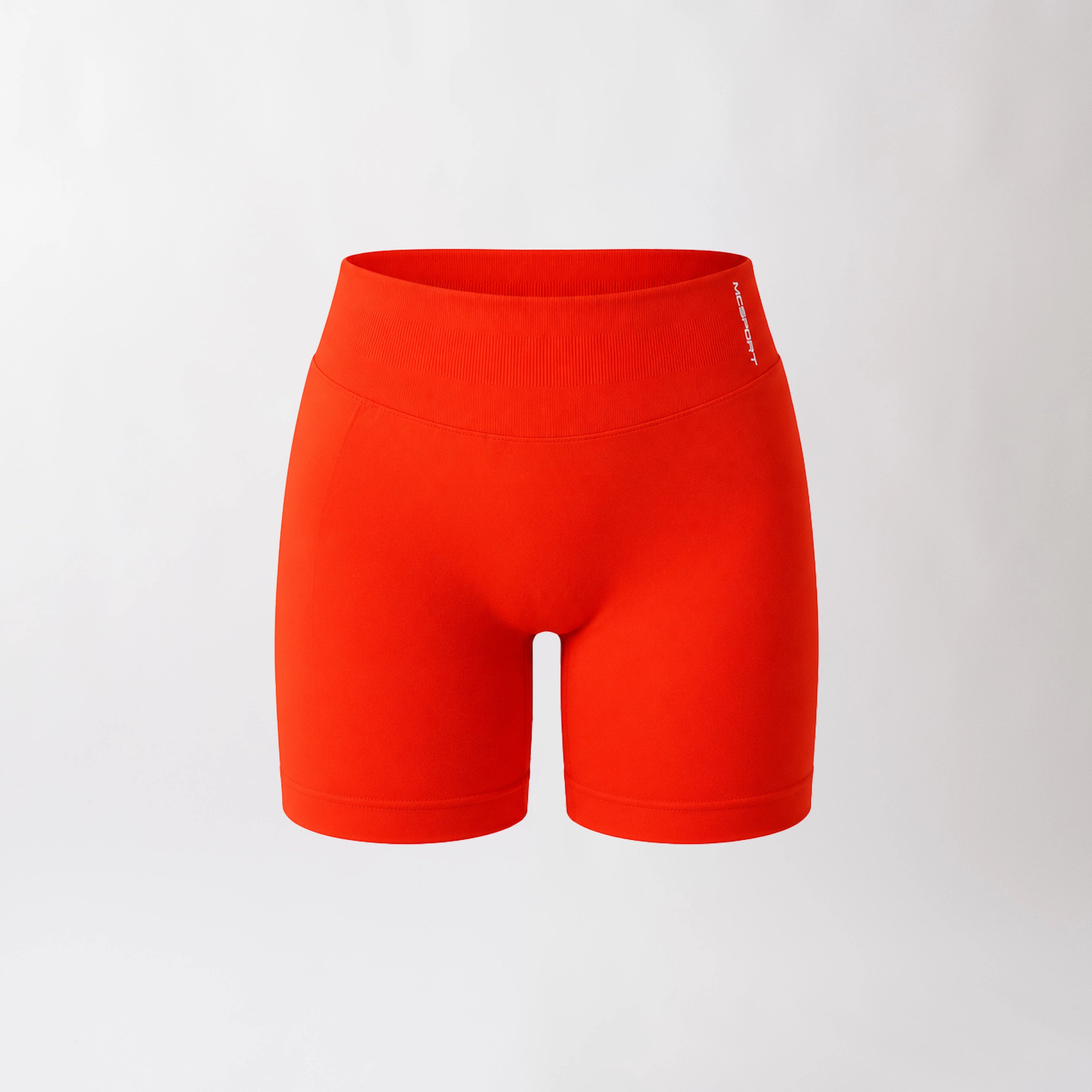 Shorts sportivi color corallo da donna con fascia alta in vita, morbidi ed elasticizzati.