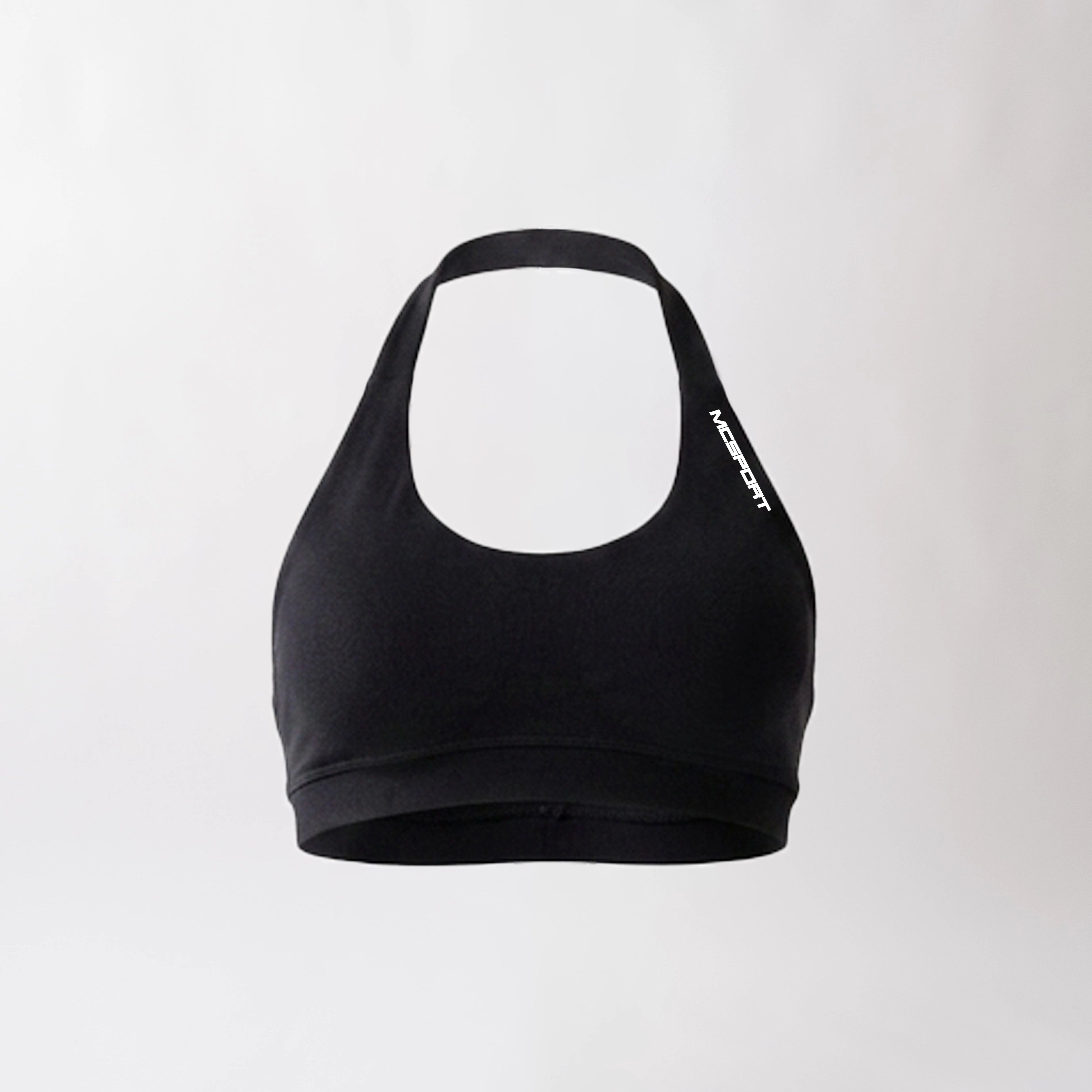 Top sportivo nero da donna dal design essenziale e confortevole, ideale per fitness, palestra, yoga e pilates.