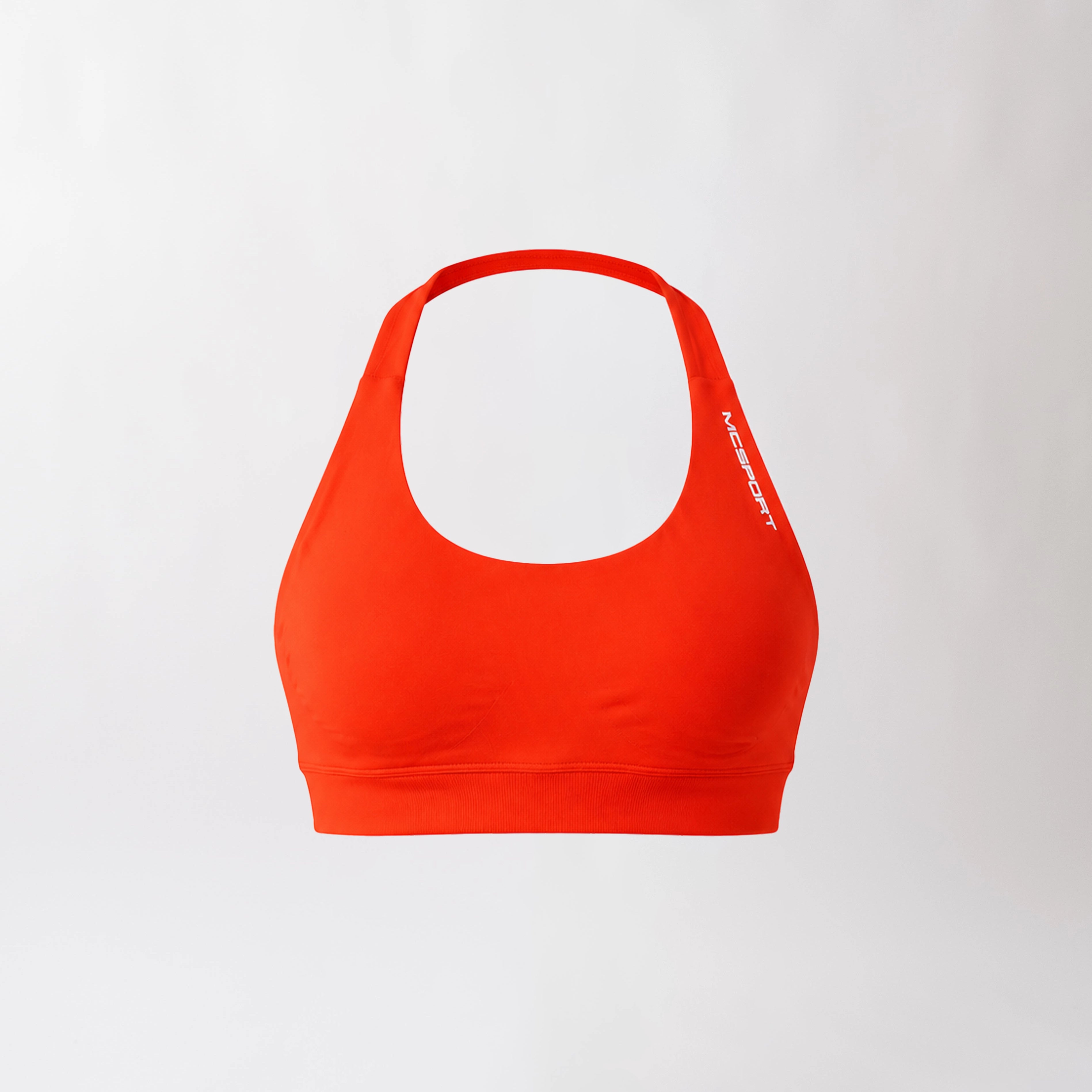 Top sportivo color corallo da donna dal design essenziale e confortevole, ideale per fitness, palestra, yoga e pilates.