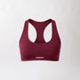 Top sportivo rosso da donna con schiena olimpionica: tessuto elasticizzato, supporto confortevole e libertà di movimento per fitness, yoga, pilates e allenamenti.