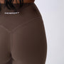 Leggings sportivi marroni da donna indossati a vita alta: tessuto elasticizzato, morbido e confortevole per fitness, yoga, pilates e allenamenti di ogni intensità.